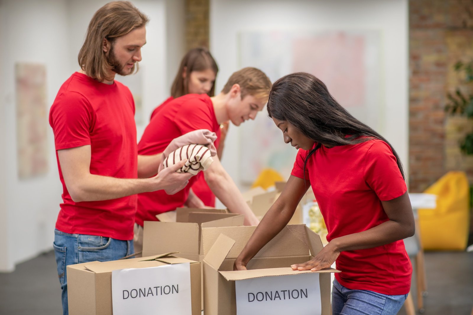 Volunteers packing supply boxes for community donation drive